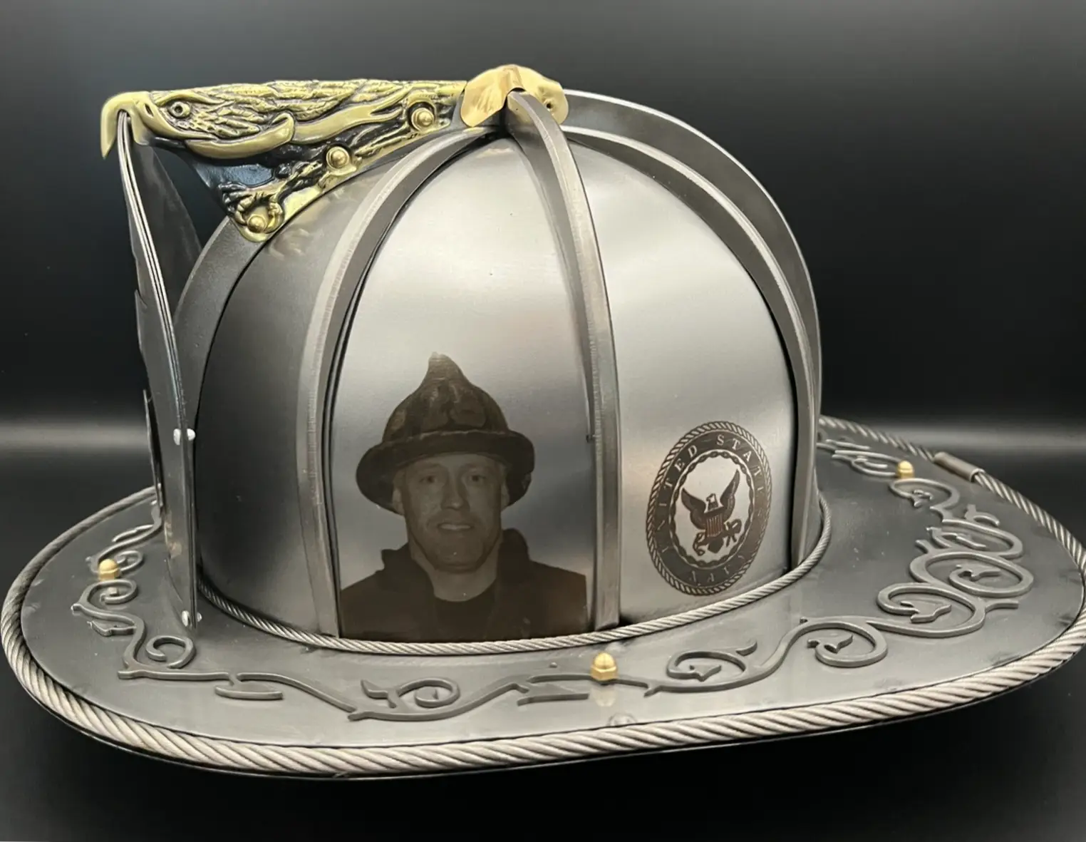 Detailed engraving work on a custom steel firefighter helmet by Torched Steel