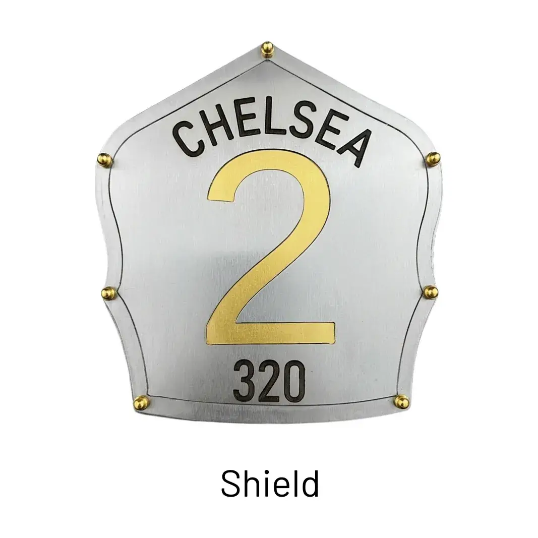 Custom text engraved on the Shield of a steel firefighter helmet by Torched Steel