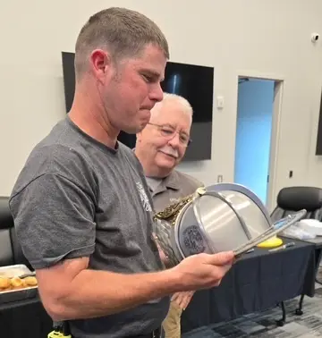 Tim with their Torched Steel helmet